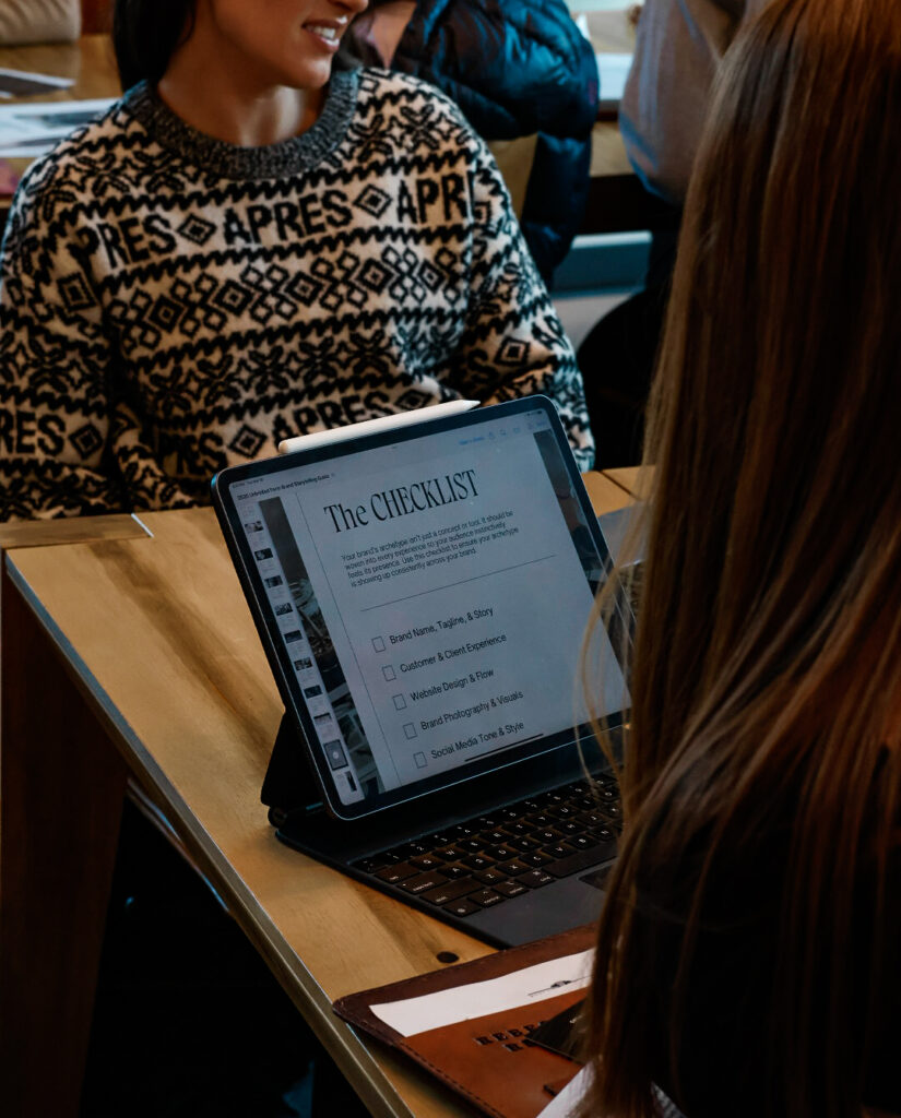 Participants journaling and reflecting on brand storytelling prompts during a creative business workshop in Montana
